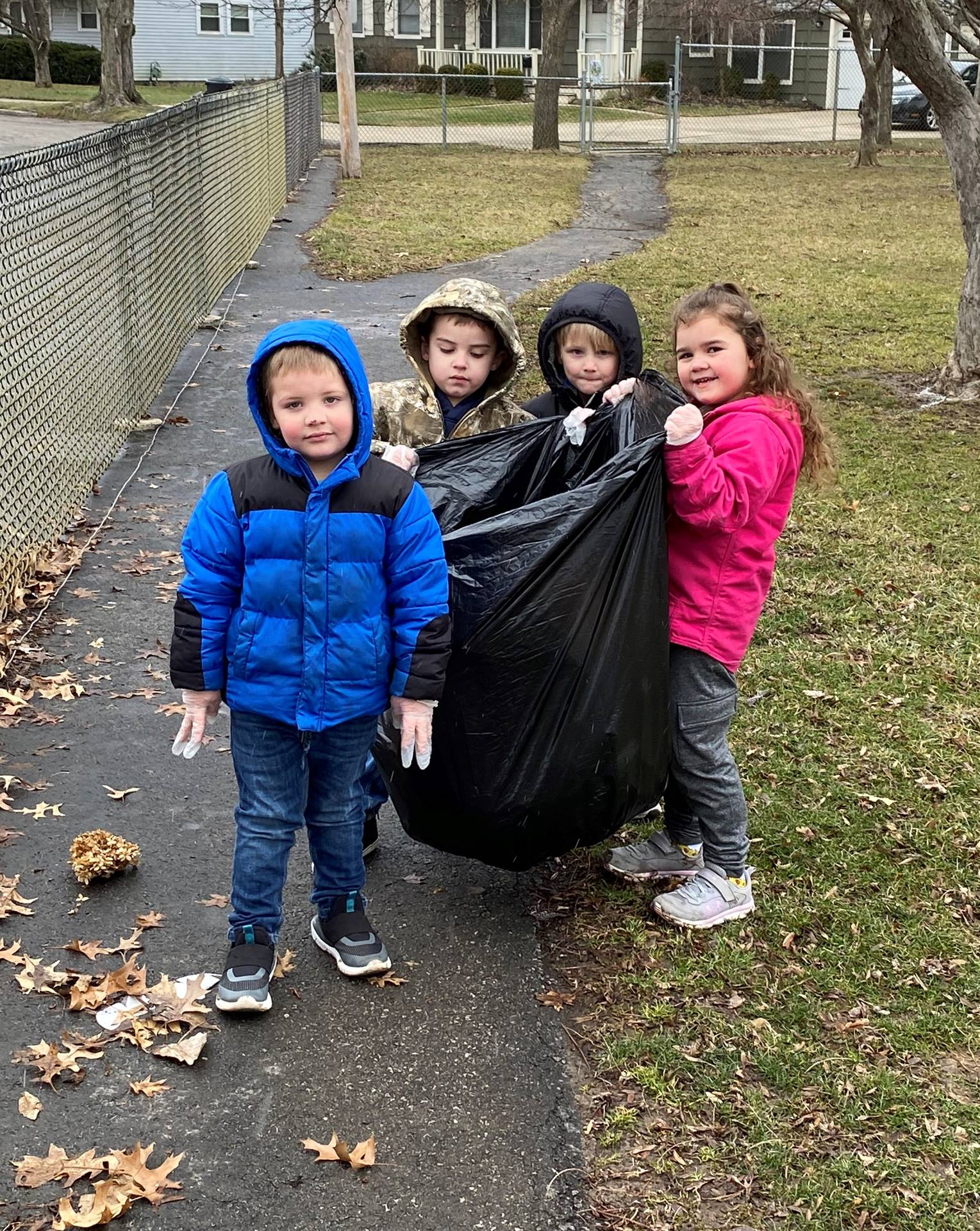 Preschool students help clean up trash