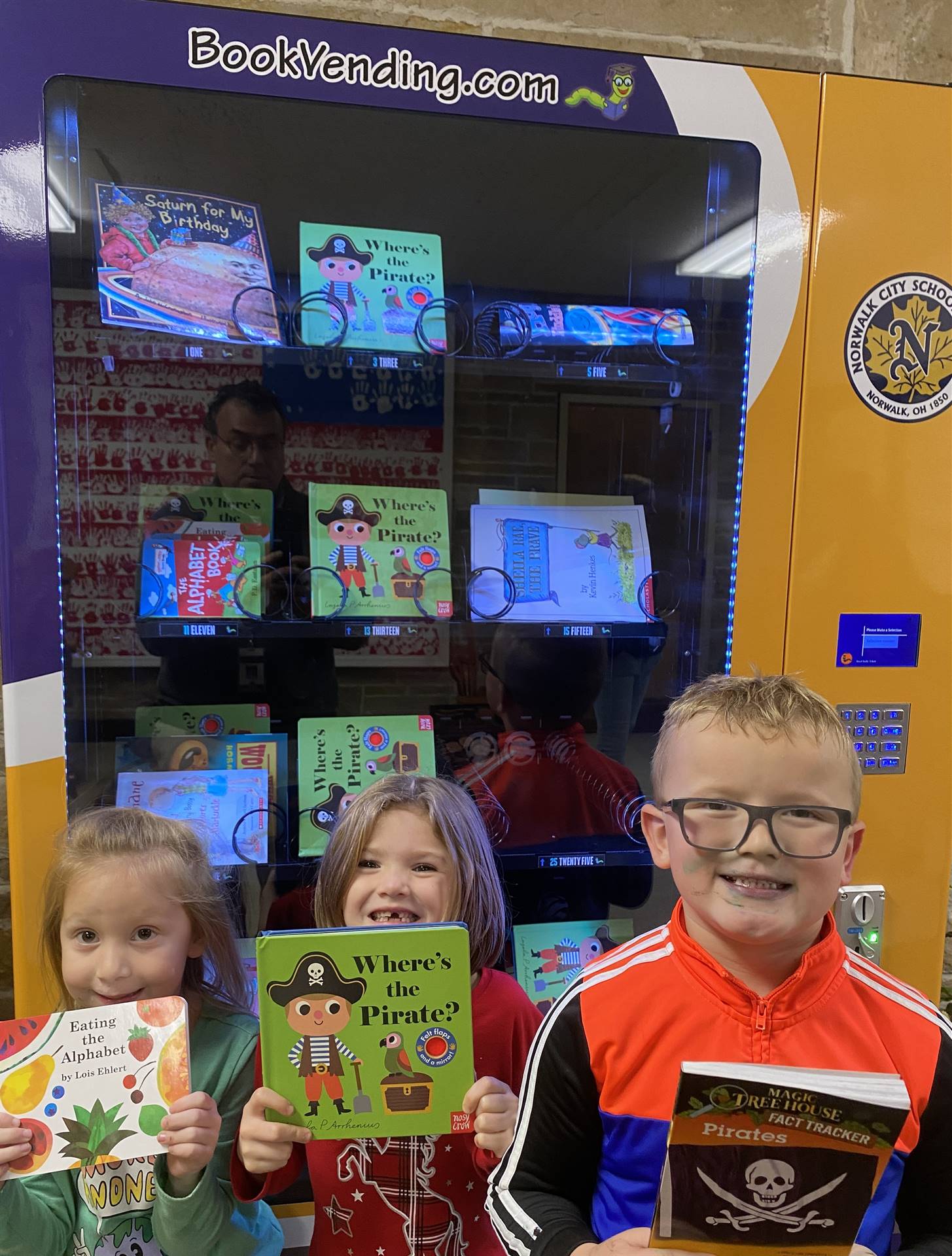 Students are thrilled to get books from the Book Vending Machine!